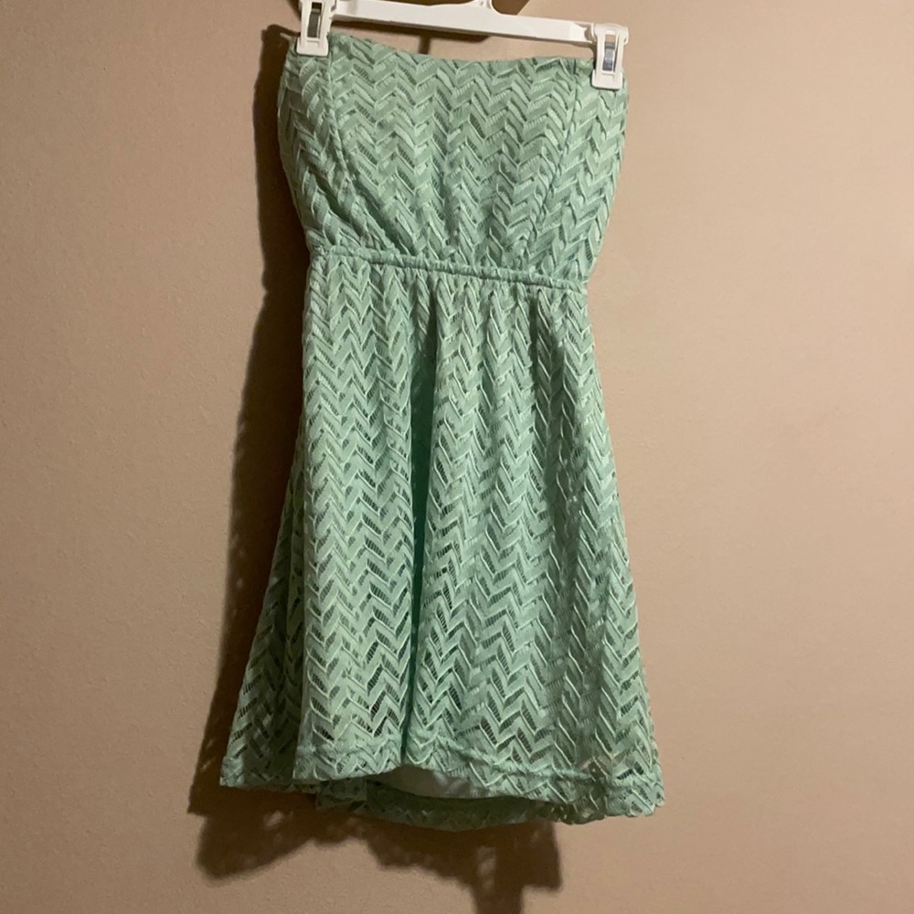 Strapless, teal dress with lace overlay and cutout back. Size medium, Rue 21.